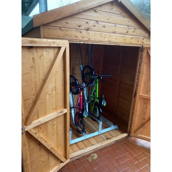 Optional four space semi-vertical bike rack with children's bikes